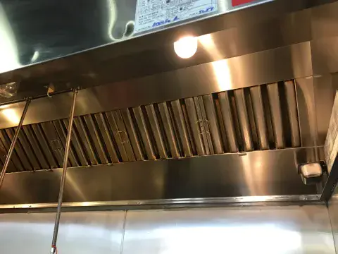 Commercial kitchen exhaust hood prepared for cleaning